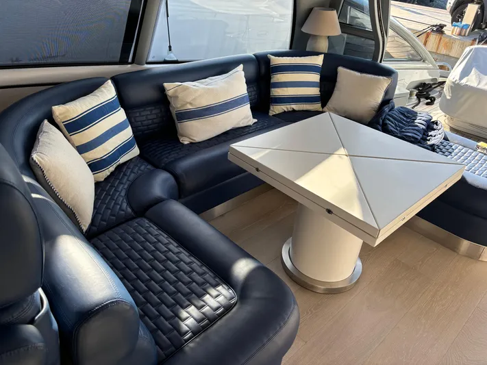  Yacht Photos Pics Luxurious interior of 2005 Baia Atlantica 78 yacht with elegant seating and modern table.