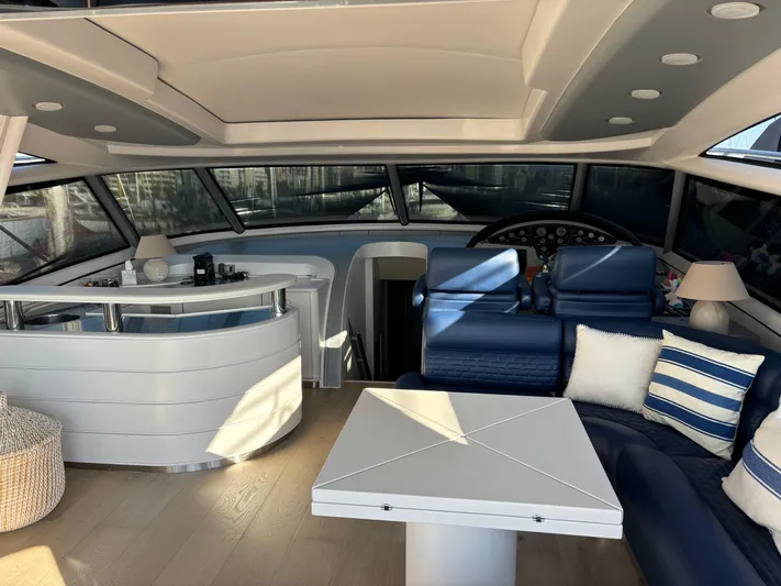  Yacht Photos Pics Luxurious interior of 2005 Baia Atlantica 78 yacht with modern seating and elegant decor.