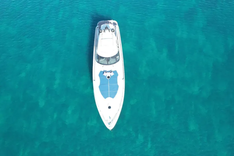  Yacht Photos Pics Aerial view of 2005 Baia Atlantica 78 yacht on clear turquoise water.