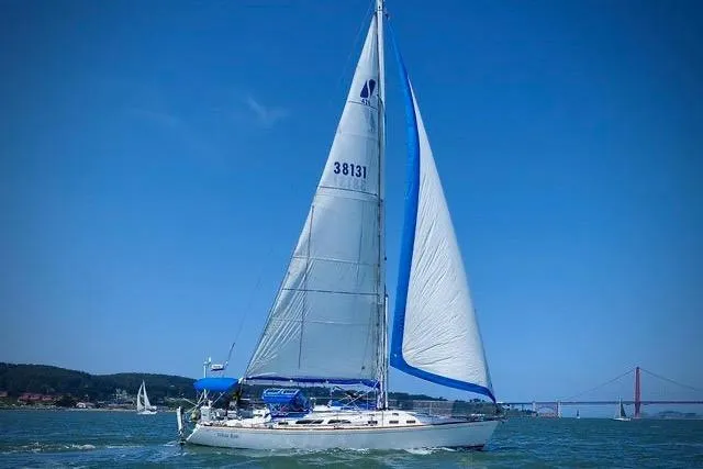 White Rose Yacht Photos Pics Sailing yacht Sabre 426, 2003 model, cruising on a sunny day with blue skies.