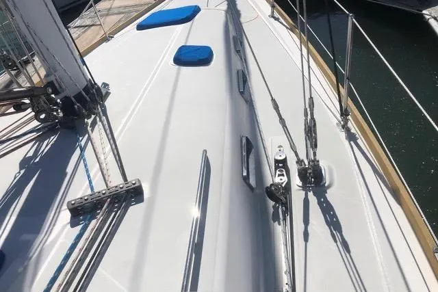 White Rose Yacht Photos Pics Deck view of 2003 Sabre 426 sailboat, featuring rigging and blue cushions.