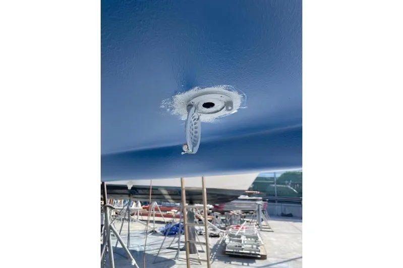 White Rose Yacht Photos Pics Close-up of a 2003 Sabre 426 boat hull with a metal fitting.