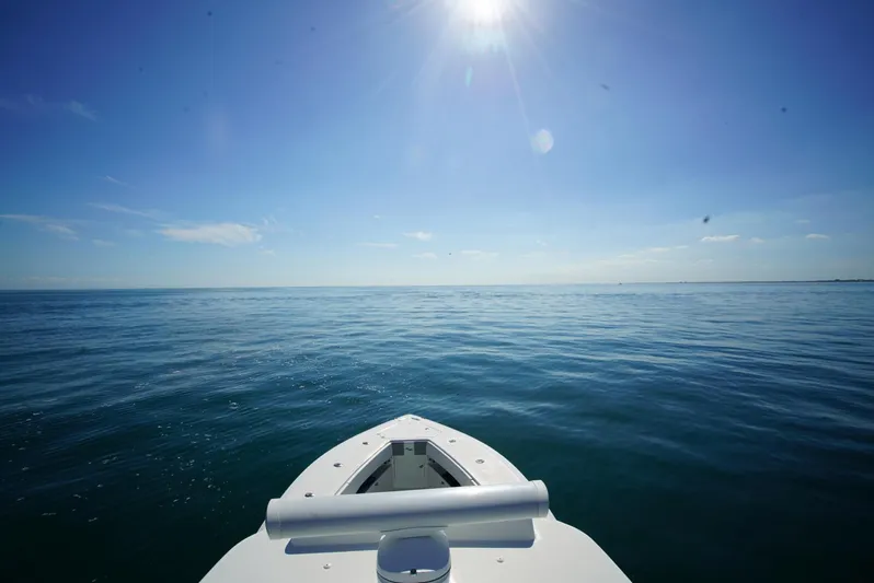 Simply Knot II Yacht Photos Pics Bow of 2018 SeaVee 390Z boat on calm ocean under clear blue sky.