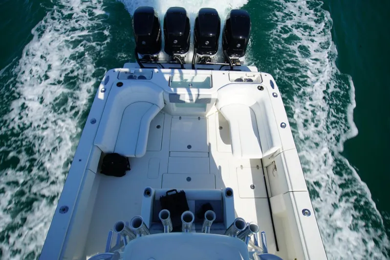 Simply Knot II Yacht Photos Pics 2018 SeaVee 390Z boat with quad engines, spacious deck, and rod holders on open water.