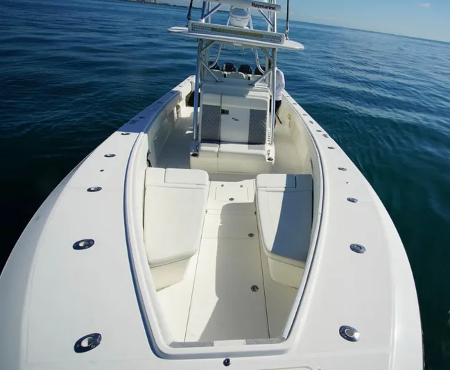 Simply Knot II Yacht Photos Pics 2018 SeaVee 390Z boat on calm ocean waters, featuring spacious seating and sleek design.