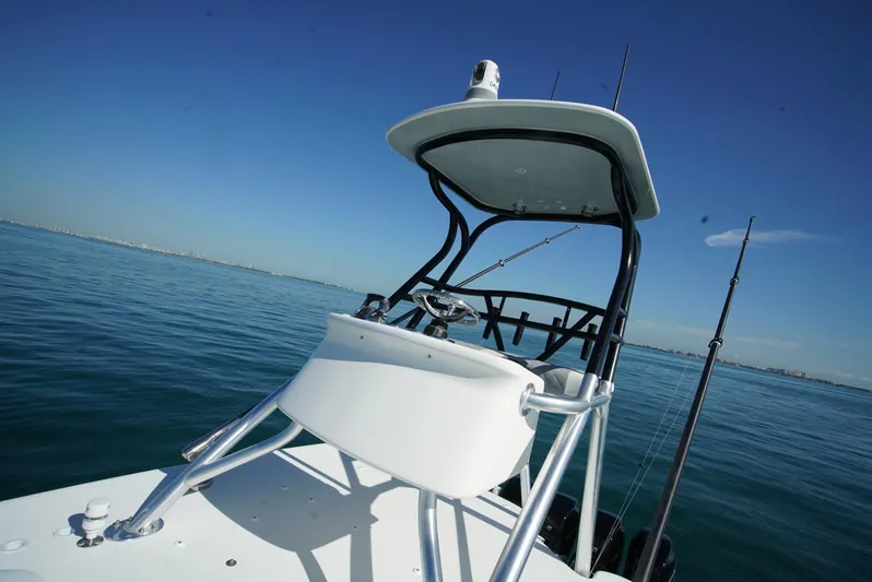 Simply Knot II Yacht Photos Pics 2018 SeaVee 390Z boat on calm ocean waters under clear blue sky.