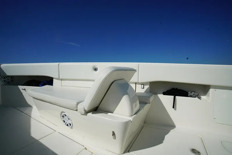 Simply Knot II Yacht Photos Pics 2018 SeaVee 390Z boat interior with white seating against a clear blue sky.