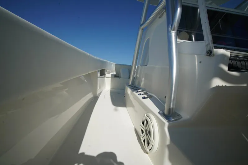 Simply Knot II Yacht Photos Pics 2018 SeaVee 390Z boat deck with stainless steel railings under clear blue sky.