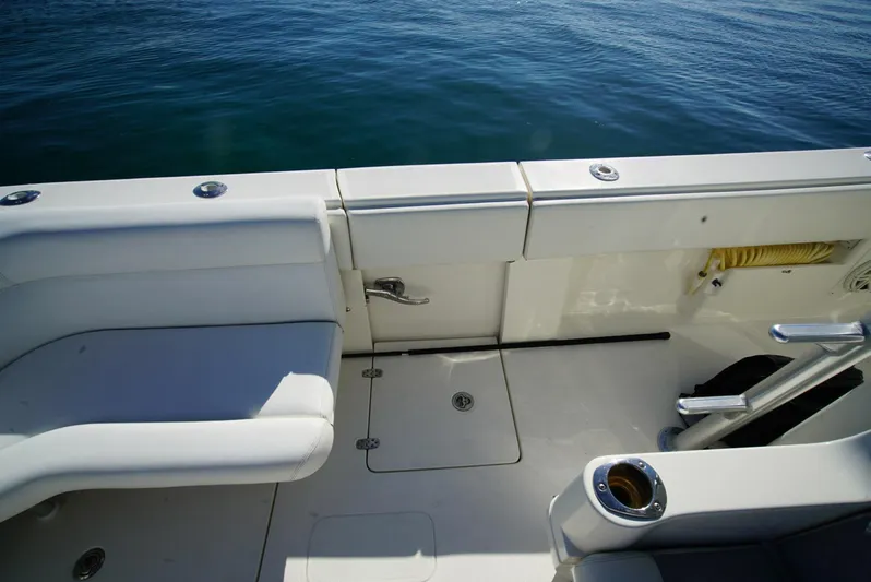 Simply Knot II Yacht Photos Pics 2018 SeaVee 390Z boat deck with seating, rod holder, and ocean view.