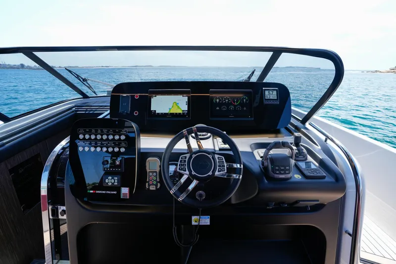  Yacht Photos Pics Cockpit of 2025 Cranchi A46 Luxury Tender with advanced navigation systems and steering wheel.