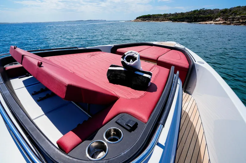  Yacht Photos Pics 2025 Cranchi A46 Luxury Tender with red sunbed, ocean view, and sleek design.