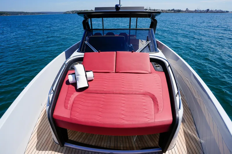  Yacht Photos Pics 2025 Cranchi A46 Luxury Tender with red sunbed on open water.