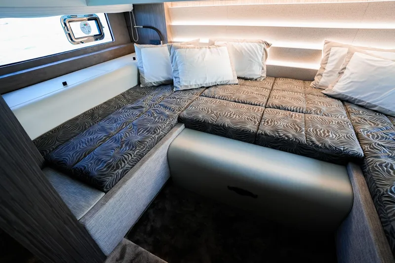  Yacht Photos Pics Luxurious cabin interior of 2025 Cranchi A46 Luxury Tender with elegant bedding and modern design.