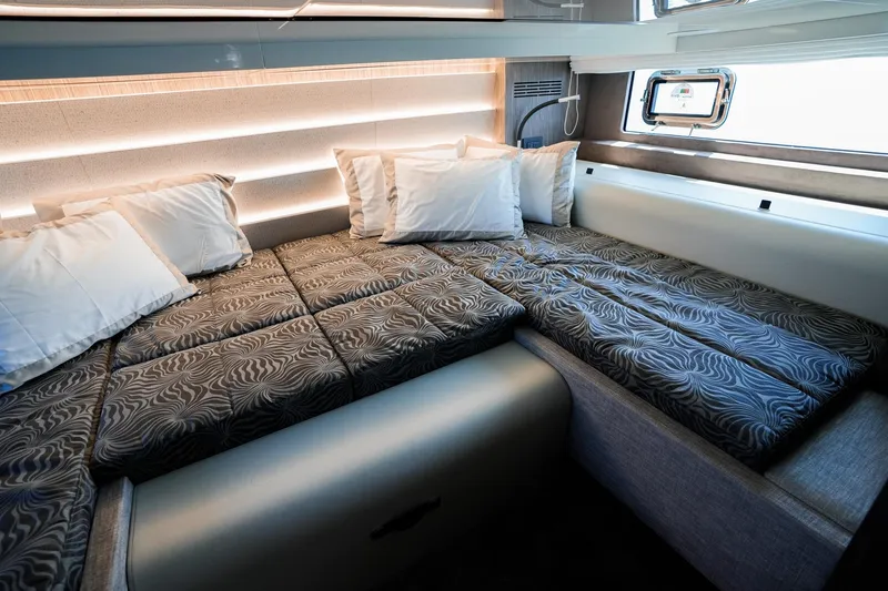  Yacht Photos Pics Luxurious interior cabin of 2025 Cranchi A46 Luxury Tender with elegant bedding.