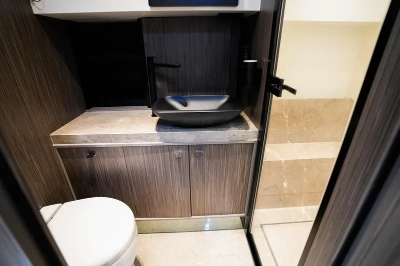  Yacht Photos Pics Luxurious bathroom interior of 2025 Cranchi A46 Luxury Tender with modern fixtures and elegant design.