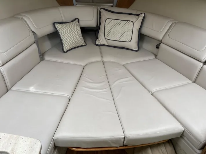  Yacht Photos Pics 2017 Formula 350 Sun Sport cabin with white leather seating and decorative pillows.