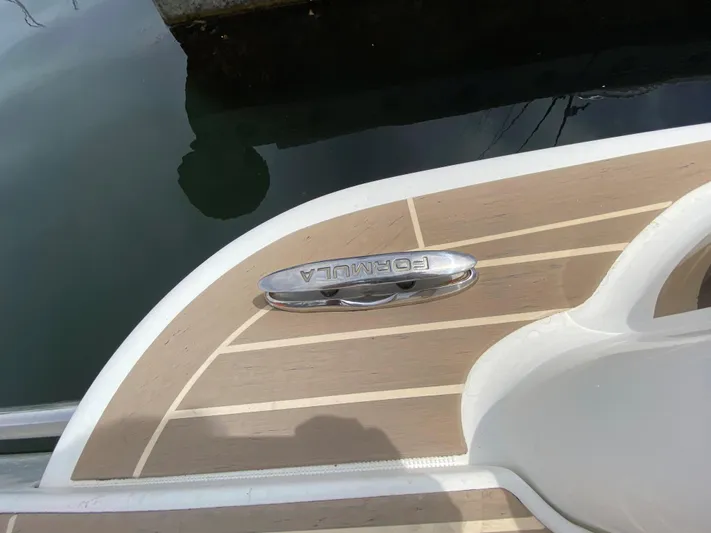  Yacht Photos Pics 2017 Formula 350 Sun Sport boat deck with logo near water.