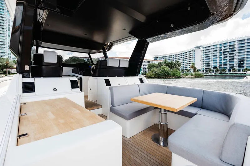 Bluegame 62 Yacht Photos Pics Interior of 2019 Bluegame BG62 yacht with modern seating and dining area.