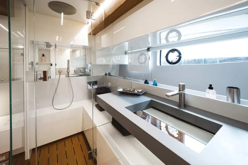 Bluegame 62 Yacht Photos Pics Luxurious bathroom in 2019 Bluegame BG62 yacht with modern fixtures and glass shower.
