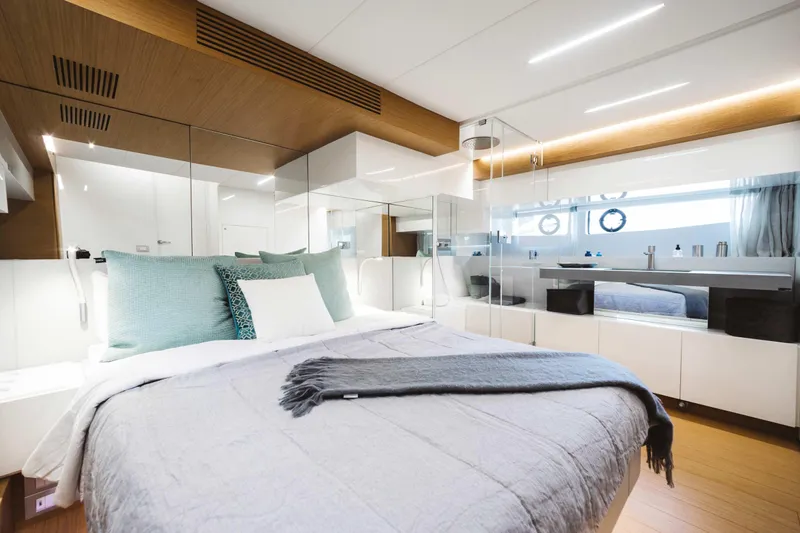 Bluegame 62 Yacht Photos Pics Luxurious bedroom interior of 2019 Bluegame BG62 yacht with modern design and elegant decor.