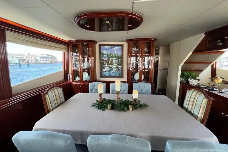  Yacht Photos Pics Luxurious dining area inside 2004 Lazzara SC Motor Yacht with elegant decor and waterfront view.
