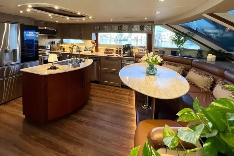  Yacht Photos Pics Luxurious 2004 Lazzara SC Motor Yacht interior with modern kitchen and elegant seating area.