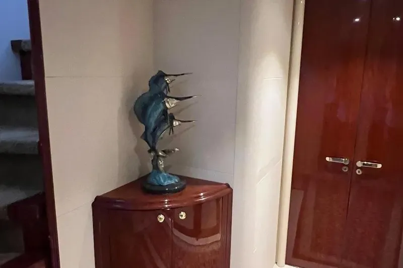  Yacht Photos Pics Interior of 2004 Lazzara SC Motor Yacht with decorative marlin sculpture and wooden cabinetry.