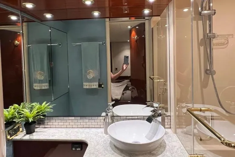  Yacht Photos Pics Luxurious bathroom interior of 2004 Lazzara SC Motor Yacht with modern fixtures and decor.