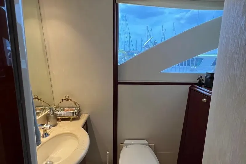  Yacht Photos Pics Luxurious bathroom interior of 2004 Lazzara SC Motor Yacht with marina view.