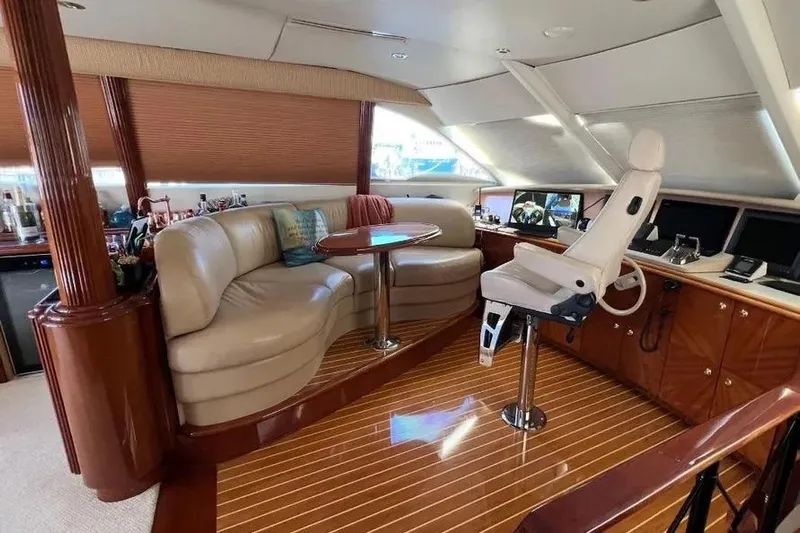  Yacht Photos Pics Luxurious interior of 2004 Lazzara SC Motor Yacht with leather seating and captain's chair.