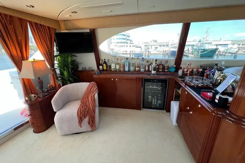  Yacht Photos Pics Luxurious interior of 2004 Lazzara SC Motor Yacht with bar and seating area.