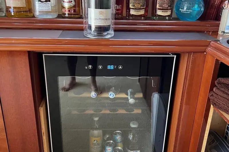  Yacht Photos Pics Luxury yacht bar with wine cooler and assorted spirits, Lazzara SC Motor Yacht 2004.