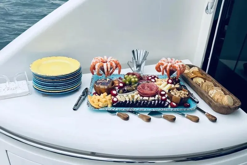  Yacht Photos Pics Luxurious charcuterie spread on 2004 Lazzara SC Motor Yacht, featuring shrimp, cheese, and crackers.