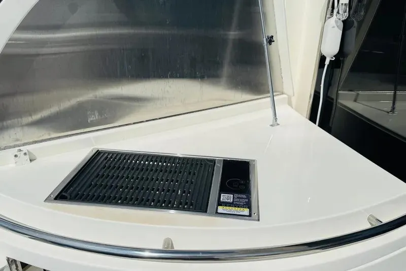  Yacht Photos Pics Outdoor grill on 2004 Lazzara SC Motor Yacht deck, featuring sleek design and modern amenities.