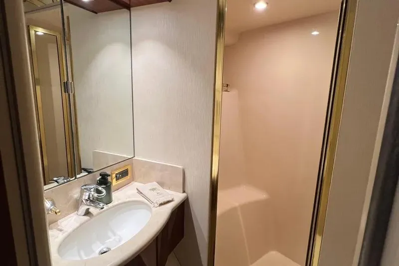  Yacht Photos Pics Luxurious bathroom in 2004 Lazzara SC Motor Yacht with elegant fixtures and lighting.