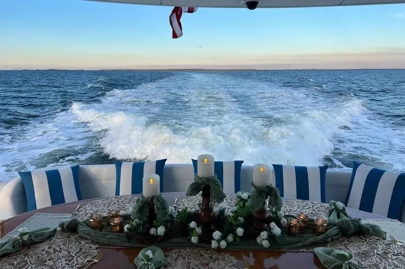  Yacht Photos Pics Luxurious 2004 Lazzara SC Motor Yacht with elegant table setting, ocean view.