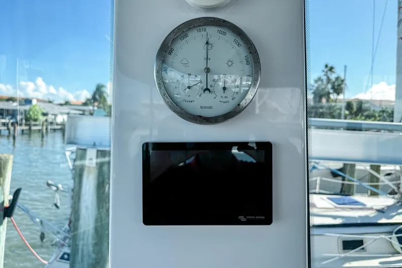  Yacht Photos Pics Barometer and display inside 2024 Axopar 37XC CROSS CABIN, with marina view.