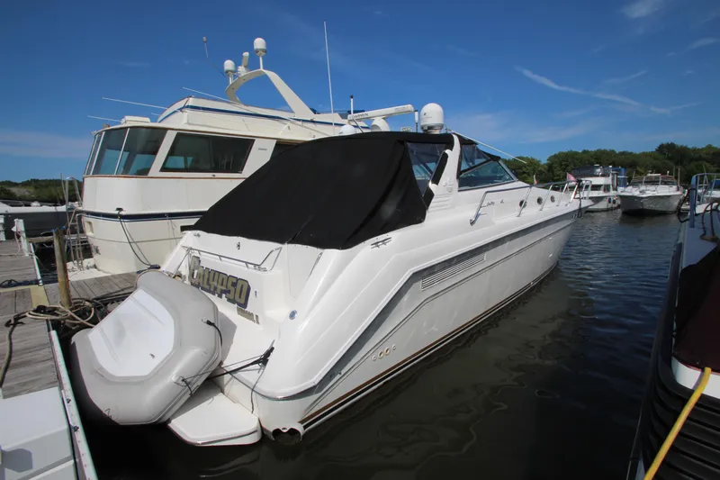  Yacht Photos Pics 1994 Sea Ray 500 Sundancer docked at marina, rear view.