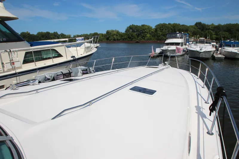  Yacht Photos Pics 1994 Sea Ray 500 Sundancer yacht docked in a marina, surrounded by other boats.