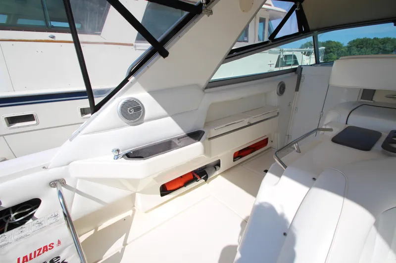  Yacht Photos Pics Interior of 1994 Sea Ray 500 Sundancer yacht, featuring white seating and modern amenities.