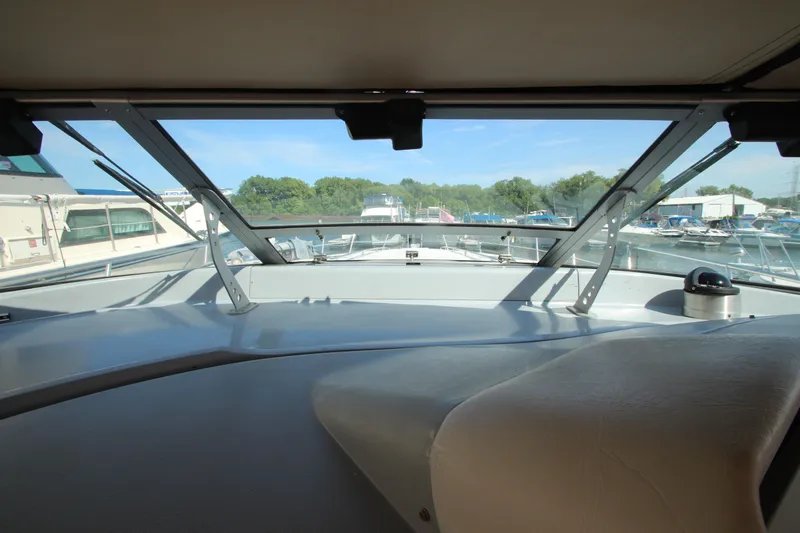  Yacht Photos Pics Interior view from 1994 Sea Ray 500 Sundancer yacht, showcasing cockpit and marina.