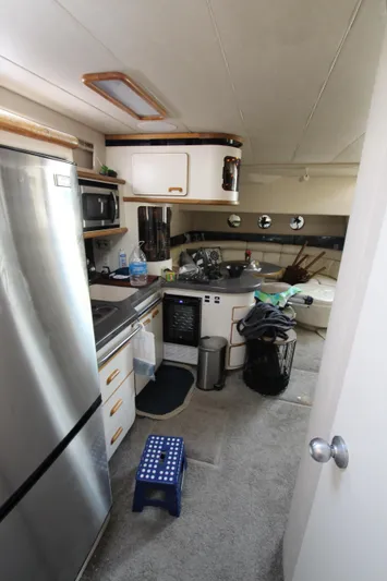  Yacht Photos Pics Interior of 1994 Sea Ray 500 Sundancer yacht kitchen with appliances and storage.