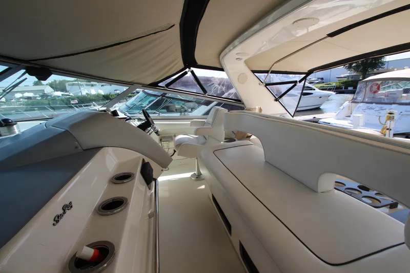  Yacht Photos Pics Interior of 1994 Sea Ray 500 Sundancer yacht, featuring sleek seating and helm area.