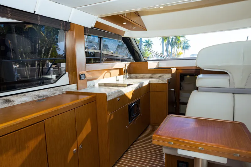  Yacht Photos Pics Luxurious interior of 2013 Bavaria Virtess 420 Fly yacht with modern kitchen and seating.