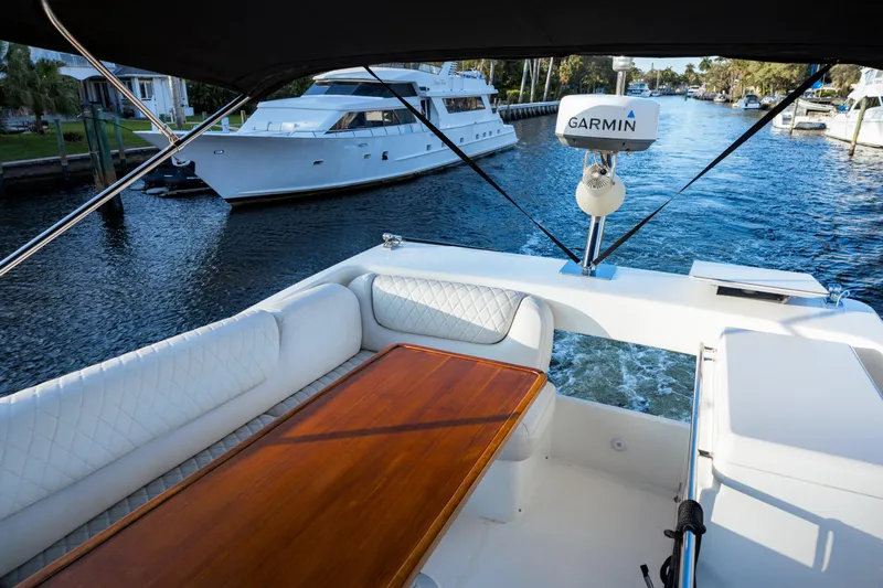  Yacht Photos Pics Flybridge view of 2013 Bavaria Virtess 420 Fly yacht with Garmin equipment on a scenic waterway.