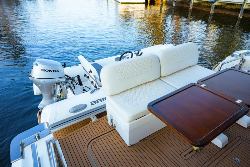  Yacht Photos Pics 2013 Bavaria Virtess 420 Fly yacht with Honda outboard motor and elegant seating area.