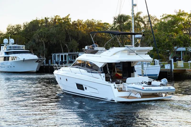  Yacht Photos Pics 2013 Bavaria Virtess 420 Fly yacht cruising on a scenic waterway.