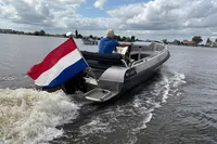 2018 Alufleet Tourer 555 boat with Dutch flag cruising on a lake.