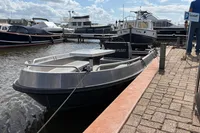 Alufleet Tourer 555 boat docked at marina, 2018 model, with other boats in background.