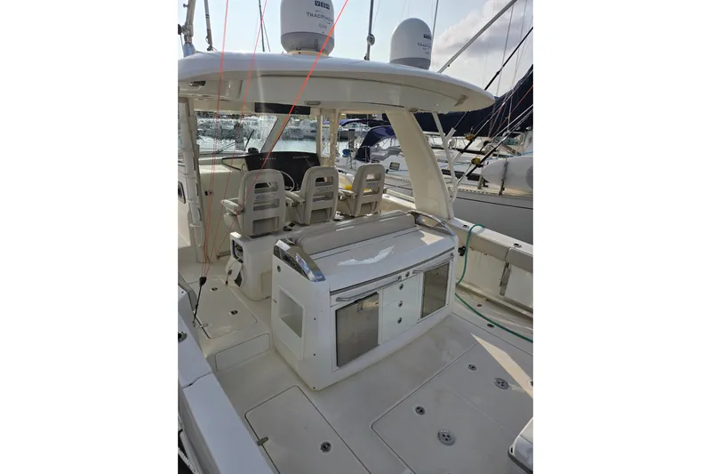  Yacht Photos Pics 2019 Boston Whaler 420 Outrage boat interior with seating and equipment.